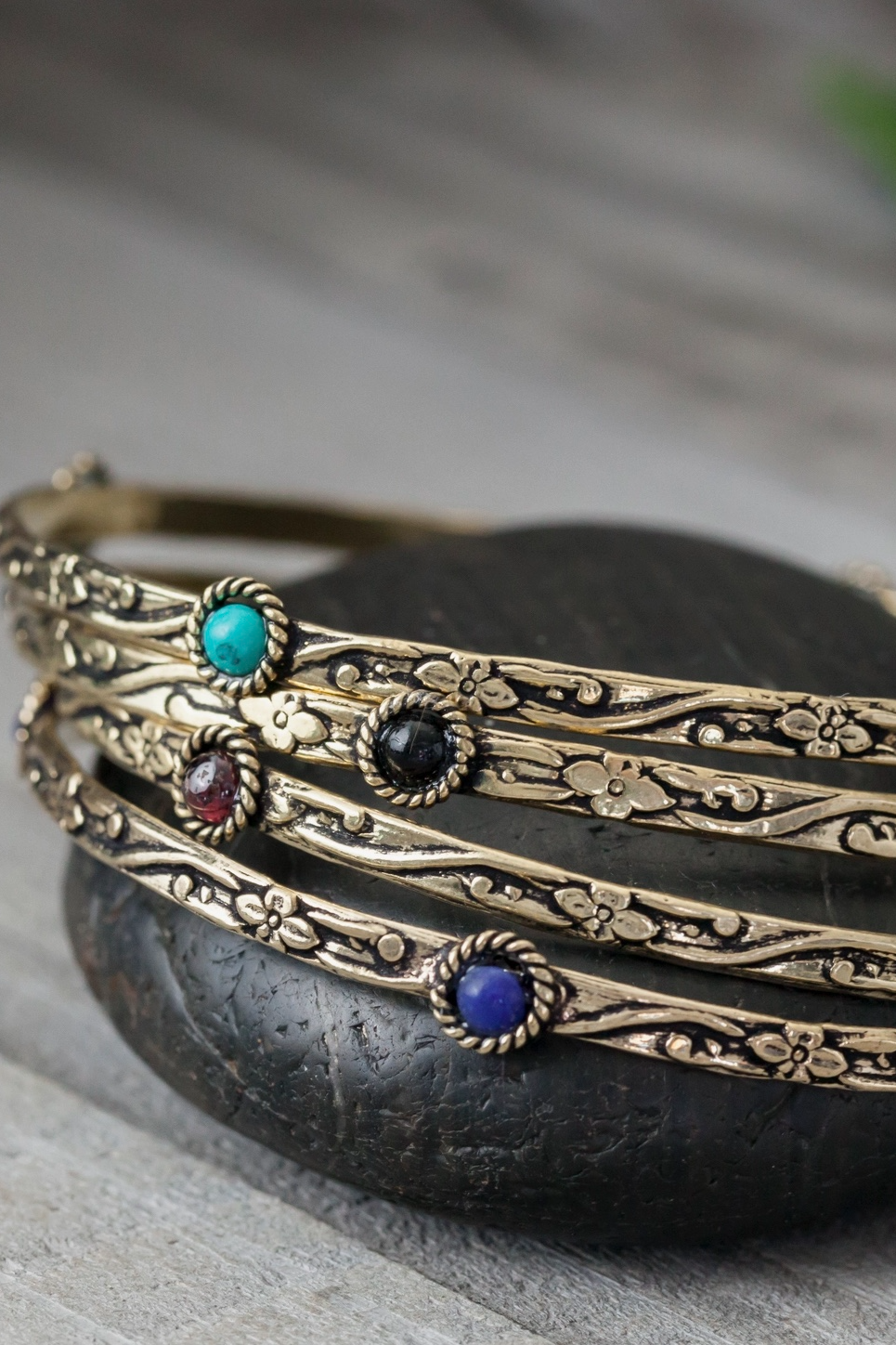 Decorated Brass Bangle Featuring Four Stones