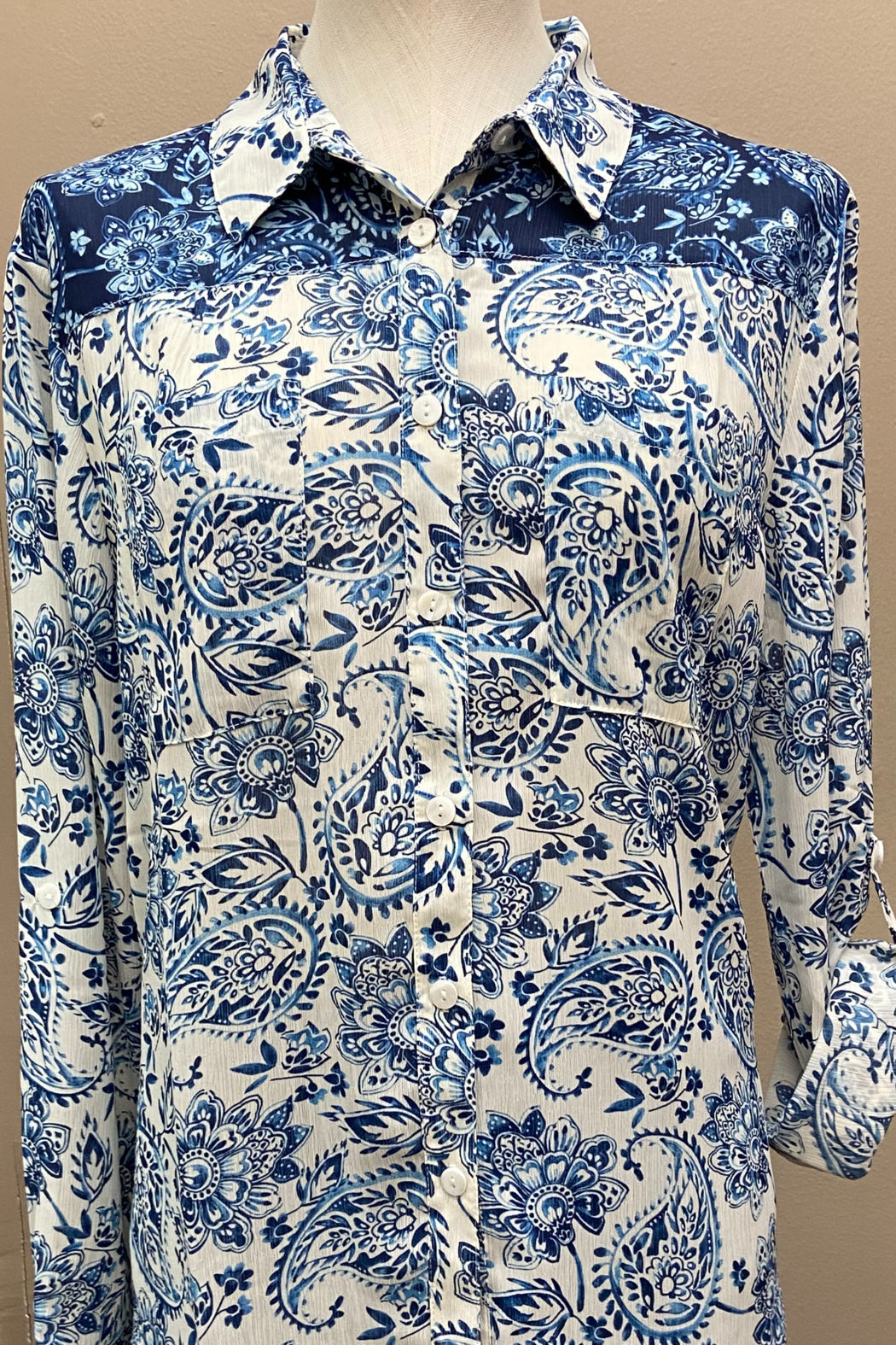 Button-down, combo yoke, crinkle georgette fabric with a paisley print shirt.