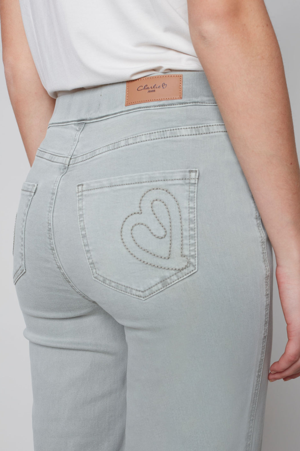 Pull on denim pant with side button detail