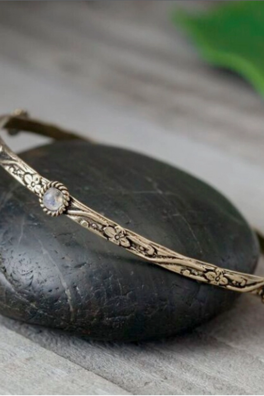 Decorated Brass Bangle Featuring Four Stones