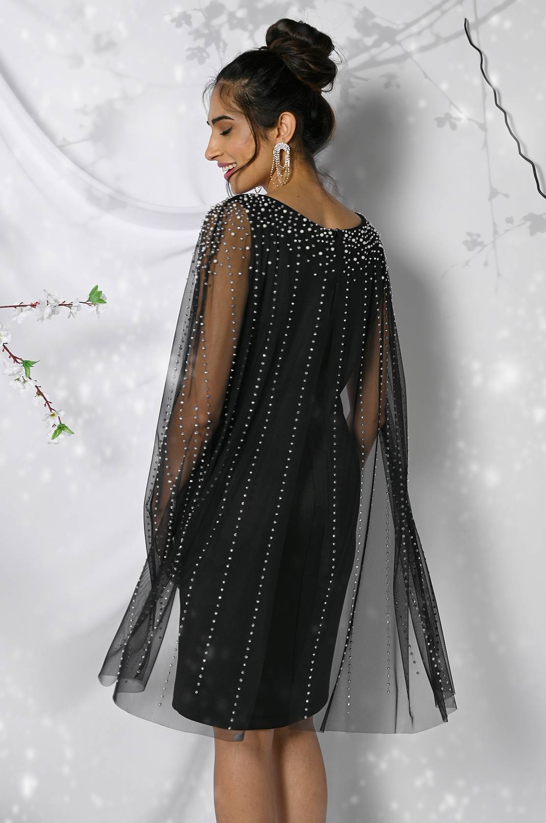 Cocktail dress with cape overlay
