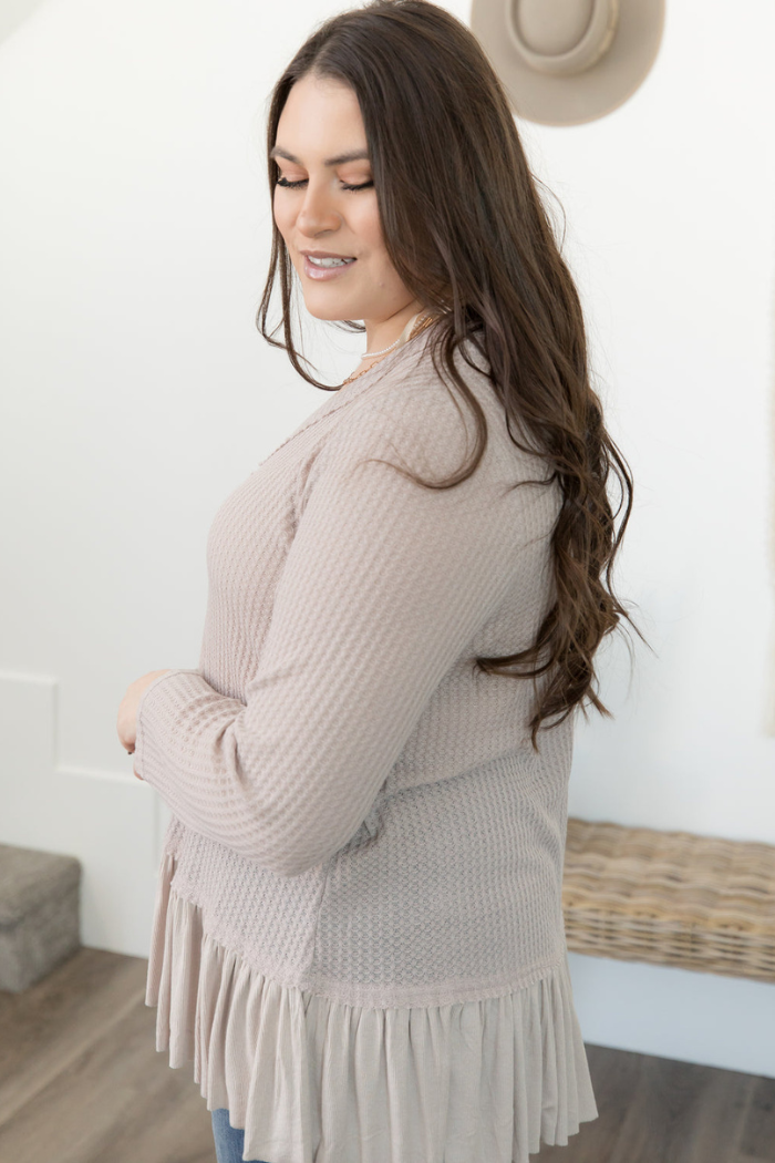Long sleeved taupe ruffled bottom