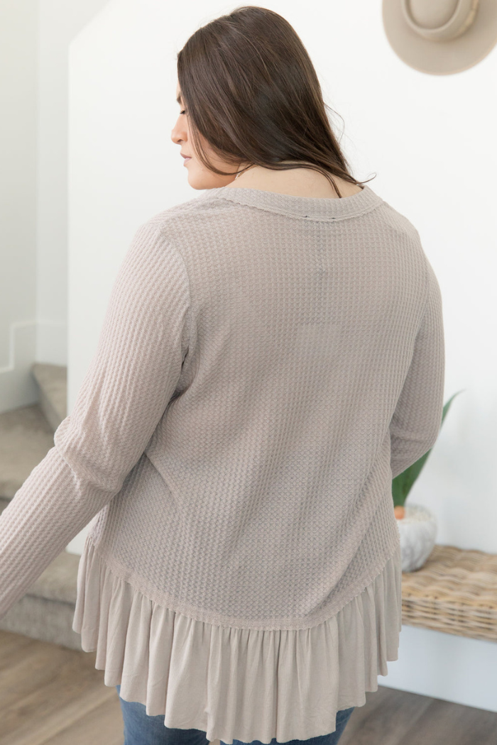 Long sleeved taupe ruffled bottom