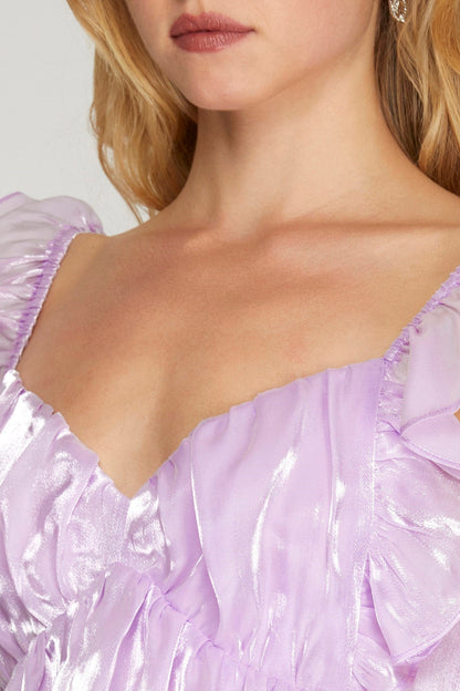 Shiny mini dress with back bow detail