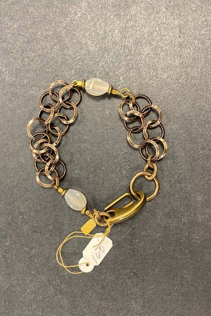 Rutilated quartz on brass circles