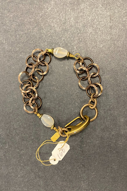 Rutilated quartz on brass circles