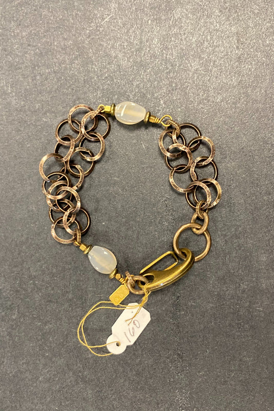 Rutilated quartz on brass circles
